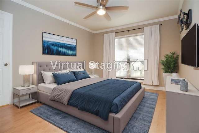 bedroom featuring ceiling fan, light wood-type flooring, and crown molding