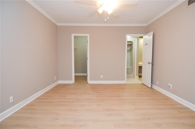 unfurnished bedroom featuring light wood finished floors, baseboards, and ornamental molding