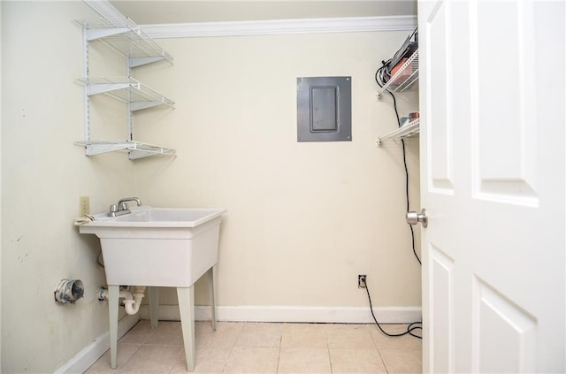 washroom with electric panel, crown molding, baseboards, and light tile patterned floors