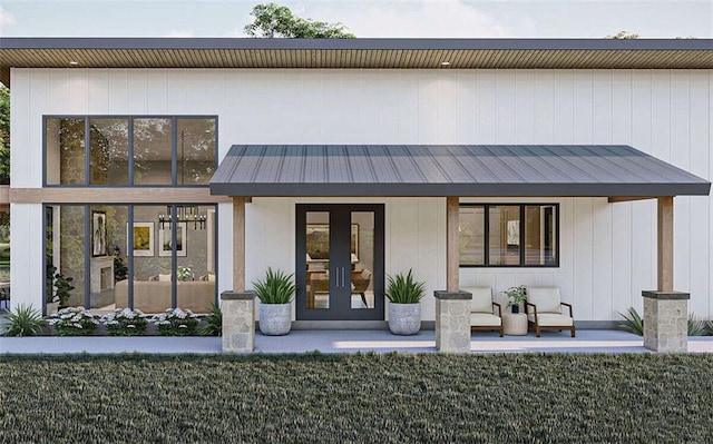 rear view of house featuring french doors