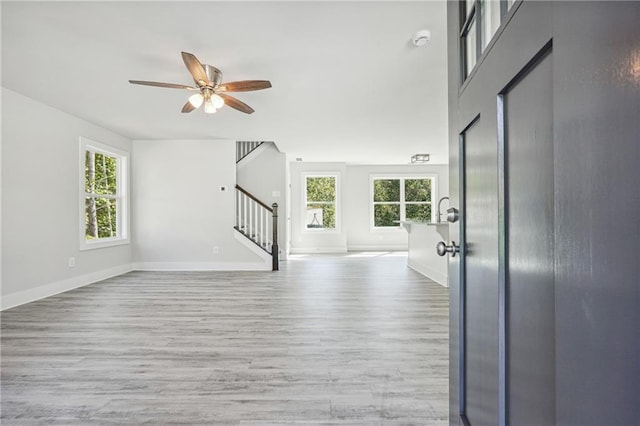 6075 Quail Mountain Trl, Gainesville, GA 30506 - entrance foyer with stairway, plenty of natural light, wood finished floors, and ceiling fan