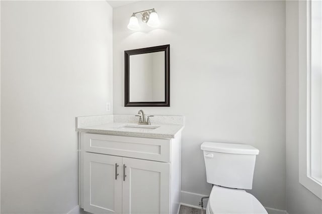6075 Quail Mountain Trl, Gainesville, GA 30506 - bathroom featuring toilet, vanity, and baseboards