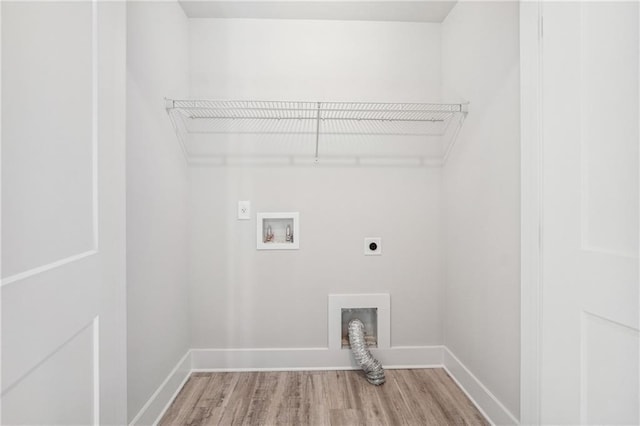 6075 Quail Mountain Trl, Gainesville, GA 30506 - washroom featuring electric dryer hookup, wood finished floors, hookup for a washing machine, and baseboards