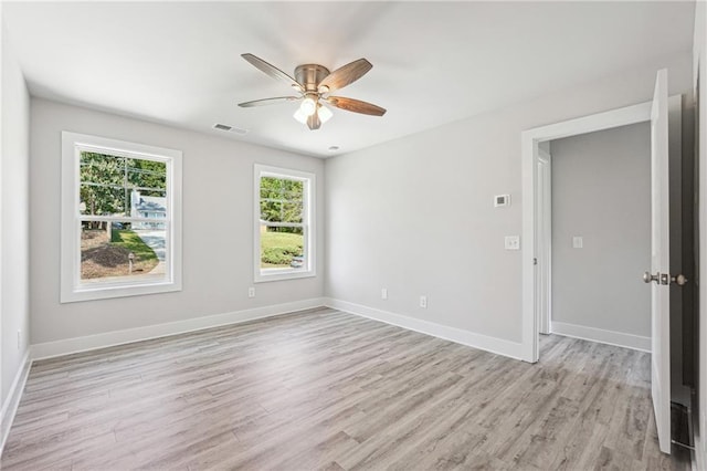 6075 Quail Mountain Trl, Gainesville, GA 30506 - empty room with light wood-style flooring, a ceiling fan, and baseboards