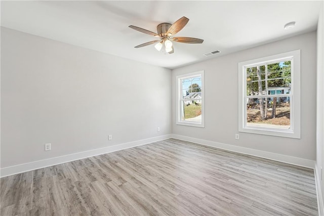 6075 Quail Mountain Trl, Gainesville, GA 30506 - unfurnished room with light wood finished floors, a ceiling fan, and baseboards