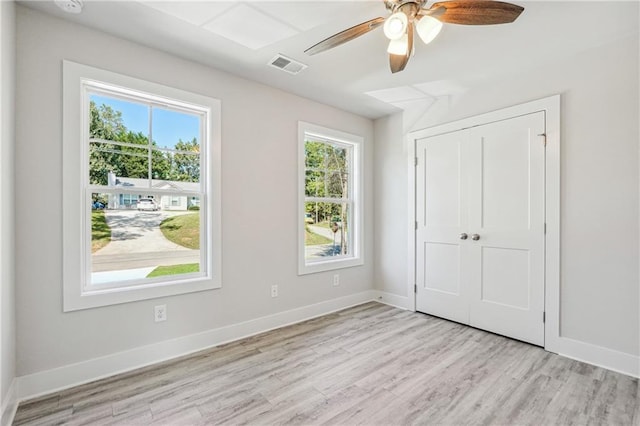 6075 Quail Mountain Trl, Gainesville, GA 30506 - unfurnished bedroom with light wood finished floors, baseboards, a closet, and ceiling fan