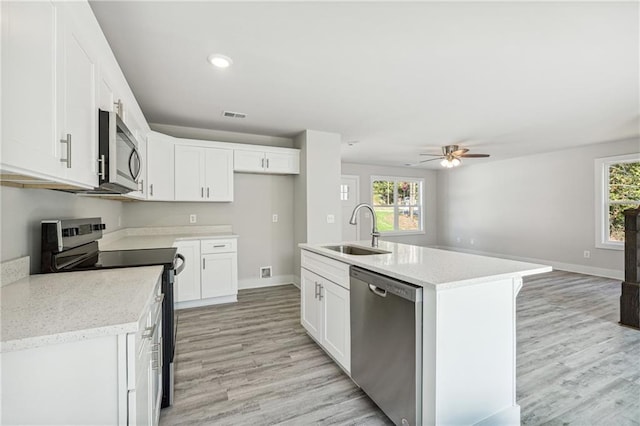 6075 Quail Mountain Trl, Gainesville, GA 30506 - kitchen featuring appliances with stainless steel finishes, a sink, ceiling fan, plenty of natural light, and recessed lighting
