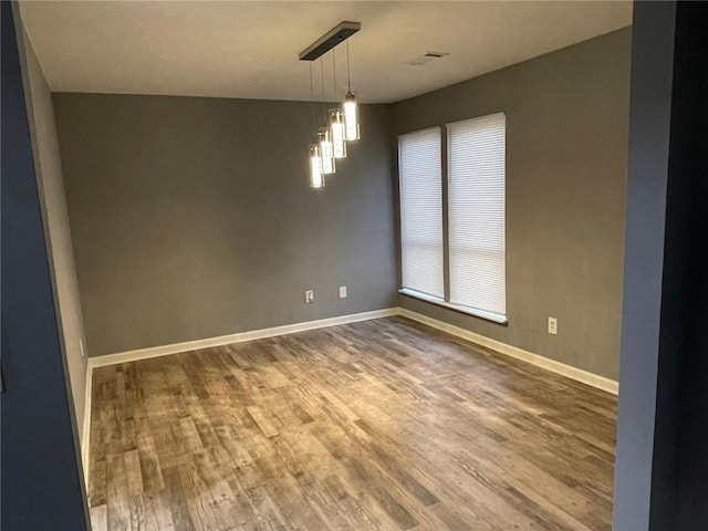 spare room featuring hardwood / wood-style flooring