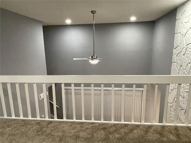 room details featuring carpet flooring and ceiling fan