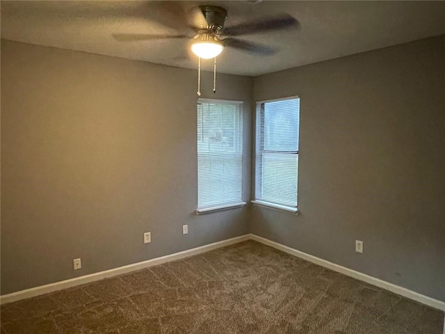 empty room with carpet floors and ceiling fan