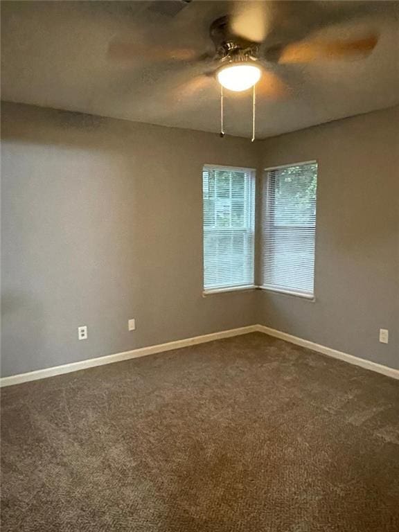 carpeted empty room with ceiling fan