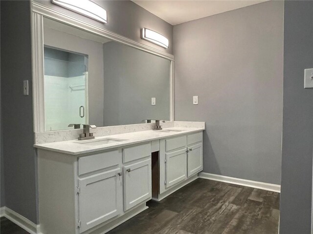 bathroom with wood-type flooring and vanity