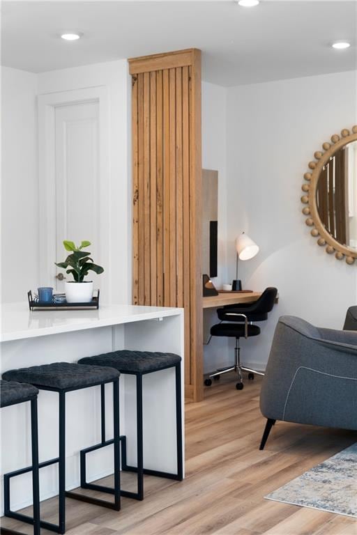 office area with light hardwood / wood-style floors