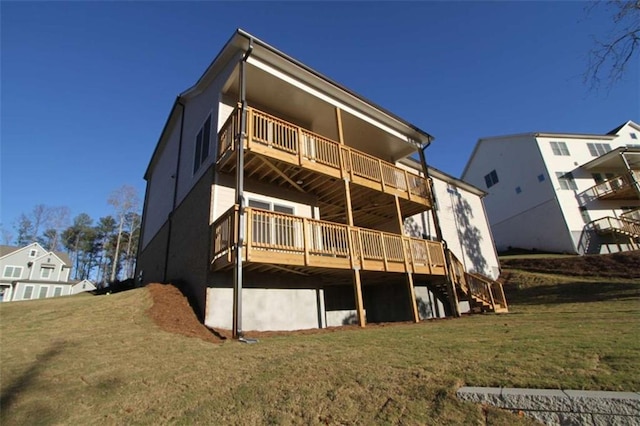 back of house with a yard and a deck