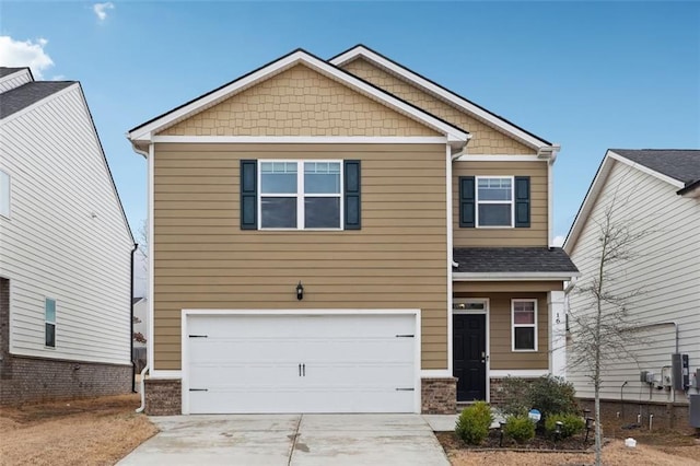 craftsman-style home with driveway, an attached garage, a shingled roof, and brick siding