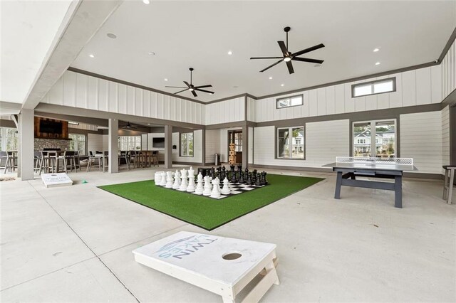 view of patio / terrace featuring ceiling fan and outdoor dry bar