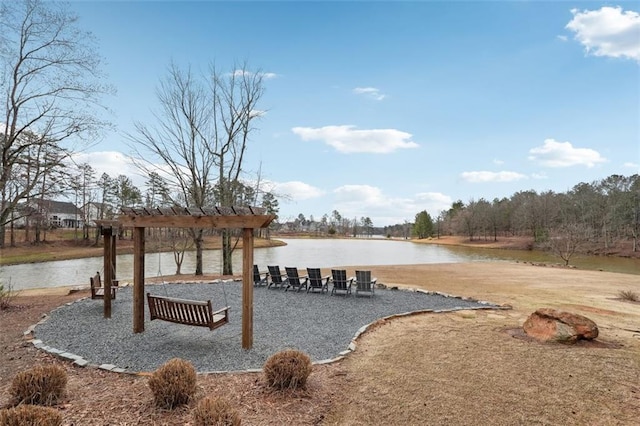 exterior space with a water view and a pergola