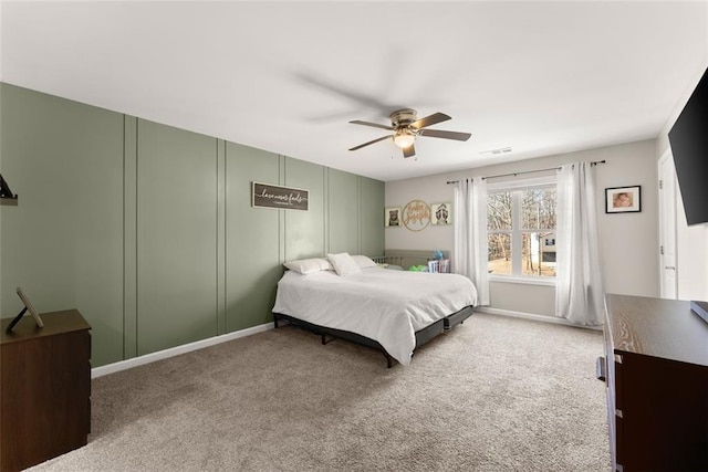 bedroom featuring visible vents, carpet, and a ceiling fan