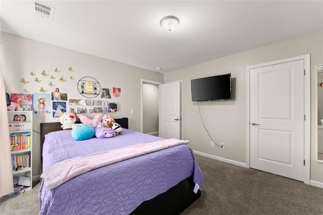 carpeted bedroom with visible vents and baseboards