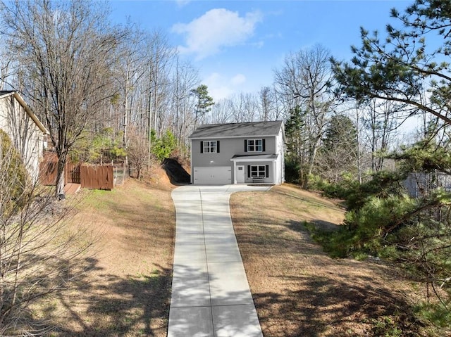 view of front of home with a garage and concrete driveway