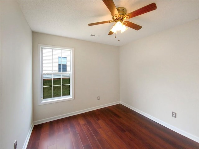 unfurnished room featuring a textured ceiling, ceiling fan, and dark hardwood / wood-style floors