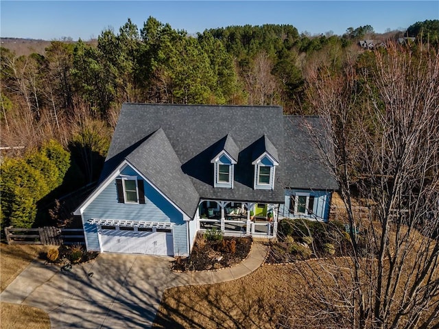 view of front of property with covered porch and a garage