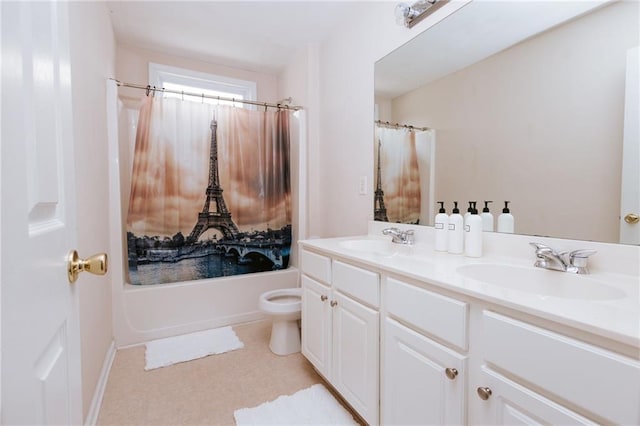 bathroom featuring shower / bath combo with shower curtain, a sink, toilet, and double vanity