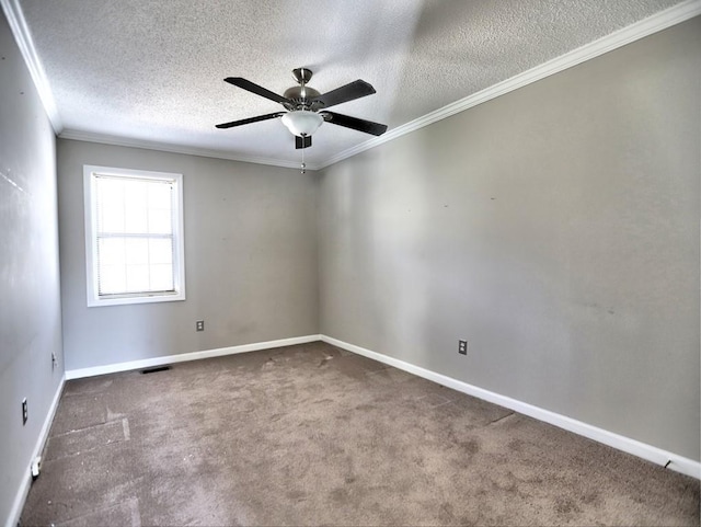 carpeted spare room with ceiling fan, a textured ceiling, and ornamental molding