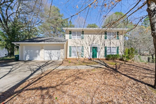 view of front facade with driveway and an attached garage