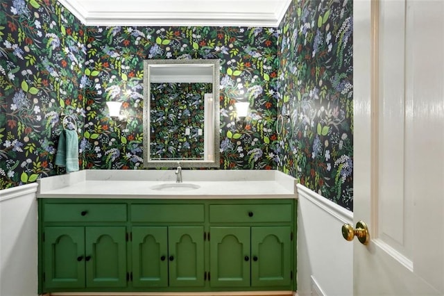 bathroom featuring crown molding and vanity