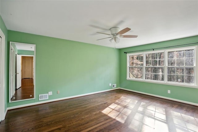 spare room featuring ceiling fan and wood-type flooring