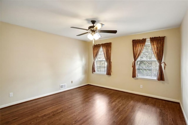 unfurnished room featuring ceiling fan and dark hardwood / wood-style floors