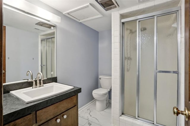 bathroom with vanity, toilet, and walk in shower