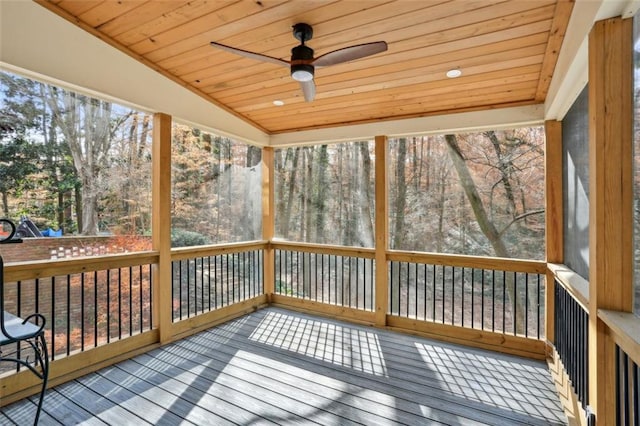 unfurnished sunroom with lofted ceiling, ceiling fan, and wood ceiling