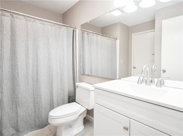 full bath with vanity, toilet, and tile patterned floors
