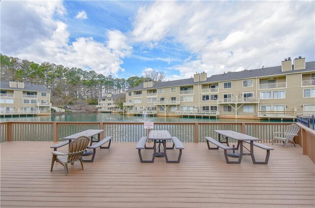 deck featuring a water view and a residential view