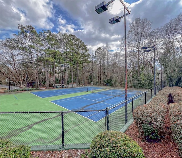 view of sport court with fence