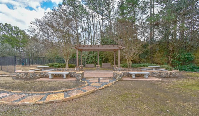 view of yard featuring a patio, fence, and a pergola