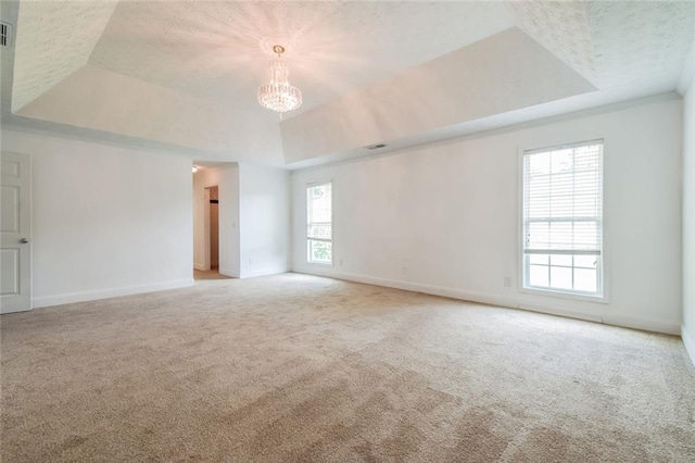 5900 Fairington Farms Ln, Stonecrest, GA 30038 - spare room with a raised ceiling, carpet, a chandelier, and a textured ceiling