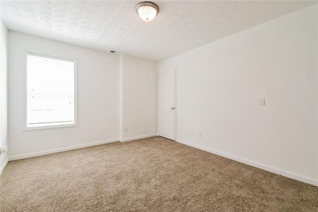 5900 Fairington Farms Ln, Stonecrest, GA 30038 - empty room featuring light carpet and a textured ceiling