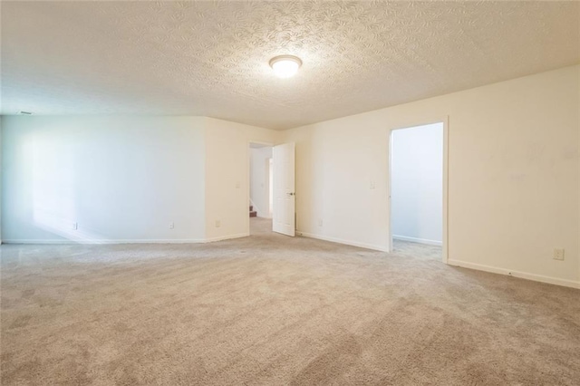 5900 Fairington Farms Ln, Stonecrest, GA 30038 - unfurnished room featuring a textured ceiling and light carpet
