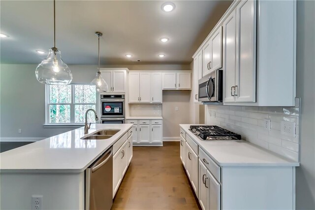 321 Principal Meridian Dr, Dallas, GA 30132 - unfurnished living room with baseboards, a ceiling fan, a fireplace with raised hearth, and wood finished floors
