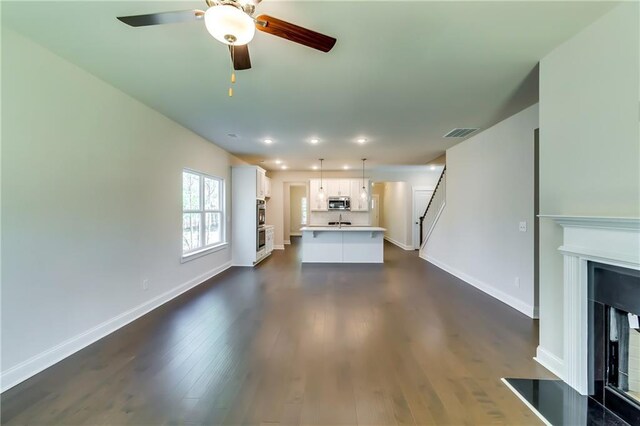 321 Principal Meridian Dr, Dallas, GA 30132 - empty room with baseboards, a ceiling fan, wood finished floors, and visible vents
