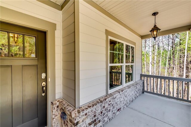 321 Principal Meridian Dr, Dallas, GA 30132 - unfurnished dining area with visible vents, light wood finished floors, a chandelier, ornamental molding, and a decorative wall