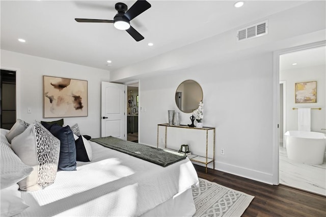 bedroom with baseboards, visible vents, dark wood finished floors, connected bathroom, and recessed lighting