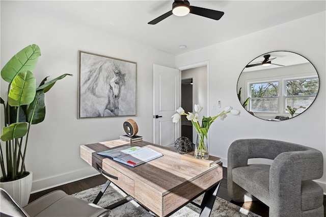 office area featuring ceiling fan, baseboards, and wood finished floors