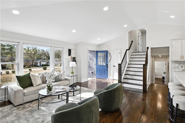 living room featuring stairway, vaulted ceiling, wood finished floors, and recessed lighting