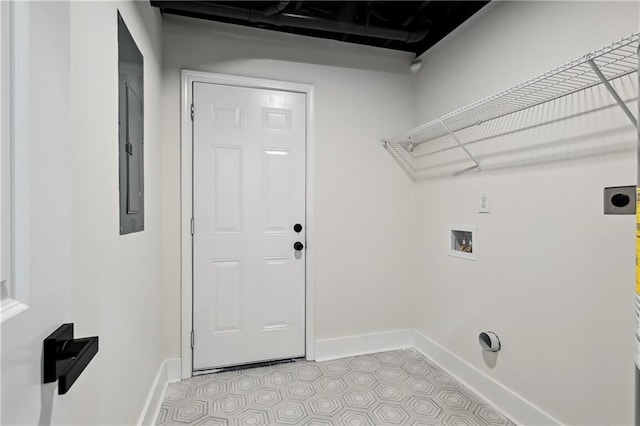 washroom with baseboards, laundry area, hookup for a washing machine, and hookup for an electric dryer