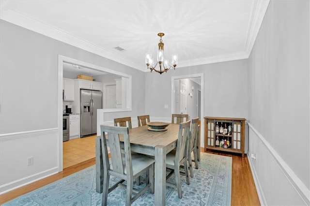 4 Mount Vernon Cir, Atlanta, GA 30338 - dining space featuring a chandelier, crown molding, and light wood-type flooring