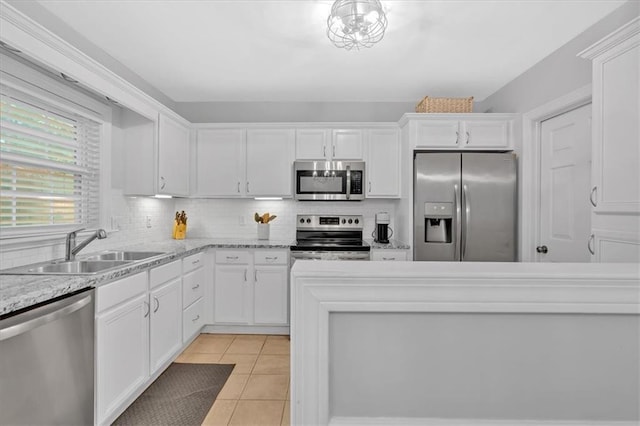 4 Mount Vernon Cir, Atlanta, GA 30338 - kitchen featuring stainless steel appliances, a sink, white cabinets, and backsplash